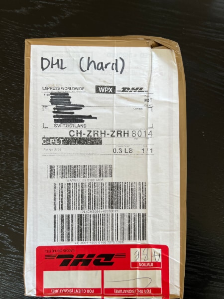DHL package label (degraded print)